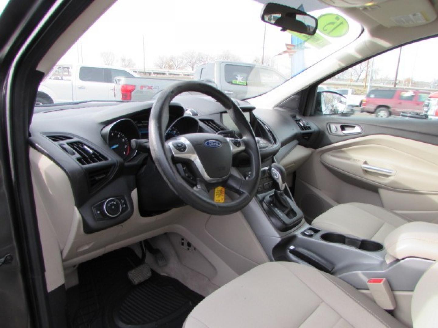 2015 Gray /Tan Ford Escape SE (1FMCU9G96FU) with an 2.0 I4 Ecoboost turbo engine engine, 6 speed automatic transmission, located at 4562 State Avenue, Billings, MT, 59101, (406) 896-9833, 45.769516, -108.526772 - 2015 Ford Escape SE 4WD 2.0 Ecoboost Turbo 4 cylinder engine - 6 speed automatic transmission - 4WD - 151,468 miles $256 per month - payment example based on $1000 cash or trade down - 36 months at 7.99 percent APR - on approved credit SE package - air conditioning - tilt and steering wheel - Photo#8